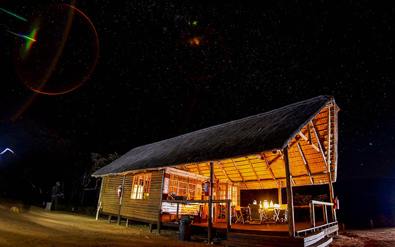 Safari tent lit up at night